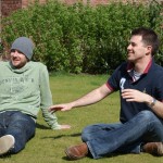 Chris & Harry sit on the grass